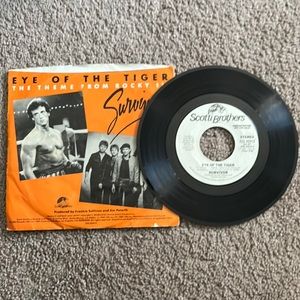 A vintage eye of the tiger record with the original sleeve it came in.